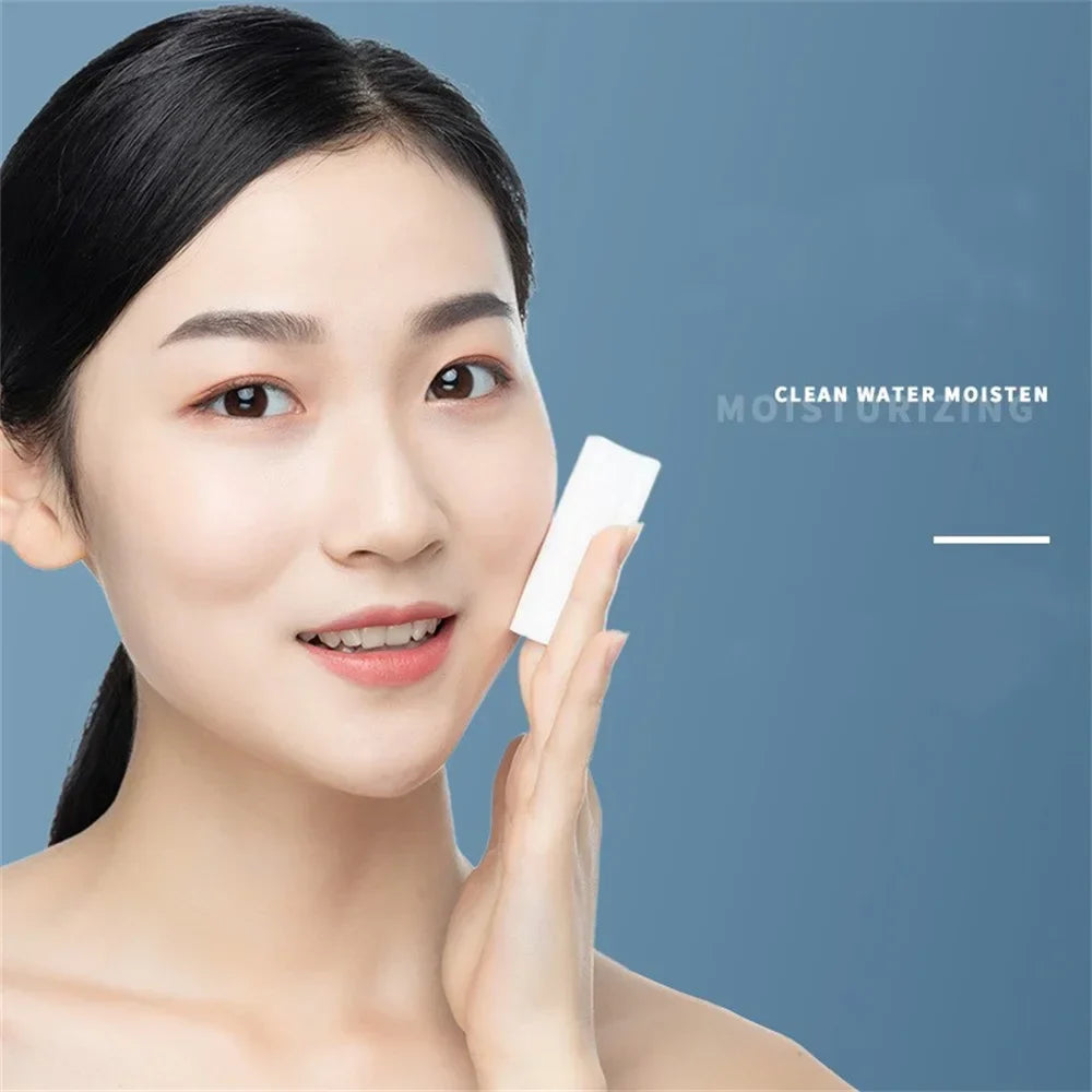 Woman using Bioaqua Micellar Water on a cotton pad to cleanse her face, illustrating gentle makeup removal.