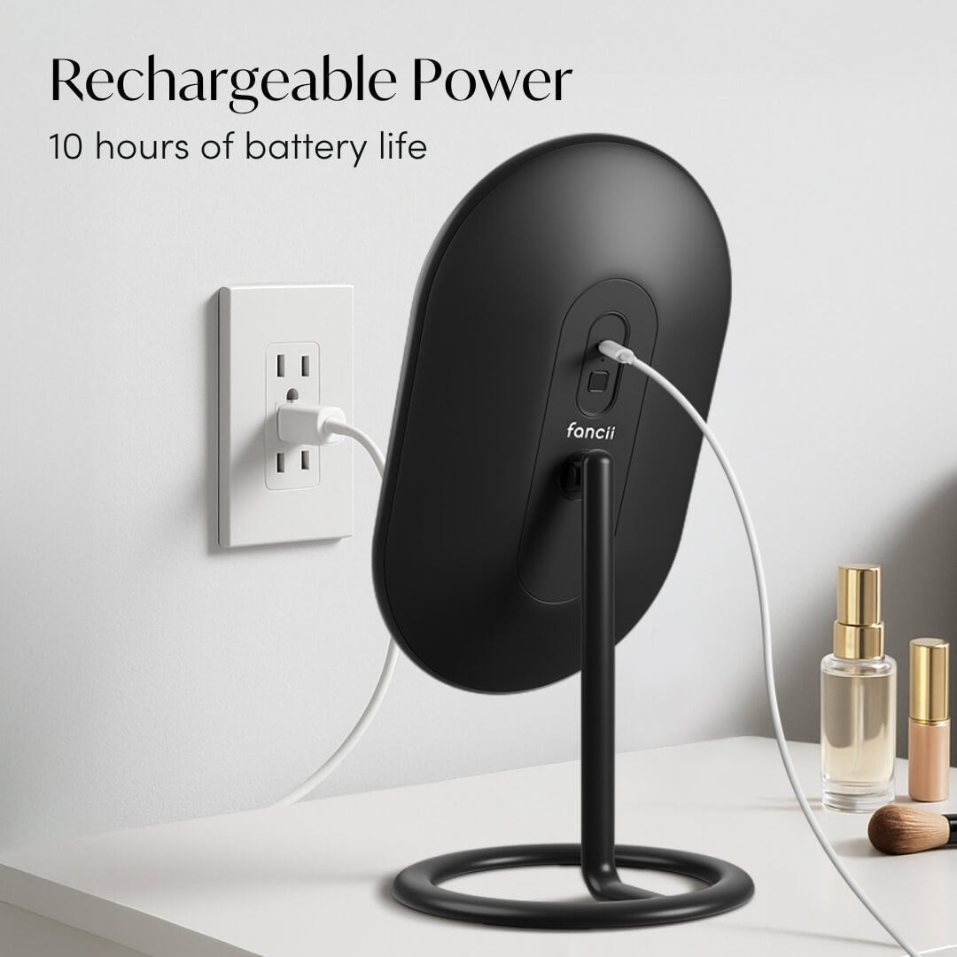 Rechargeable black Vera LED vanity mirror plugged into a wall outlet, showing 10 hours of battery life feature.