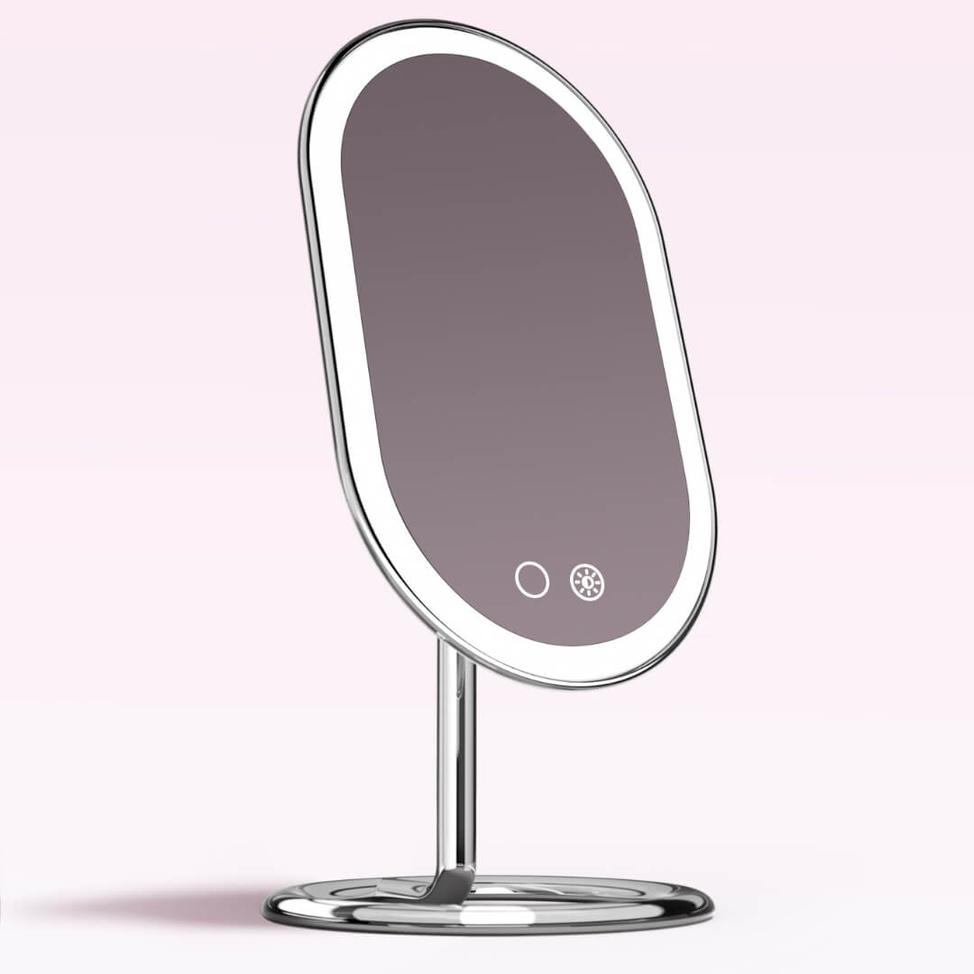 Vera Lighted Vanity Mirror with sleek aluminum finish, LED light ring, and touch sensors on a sturdy silver base.